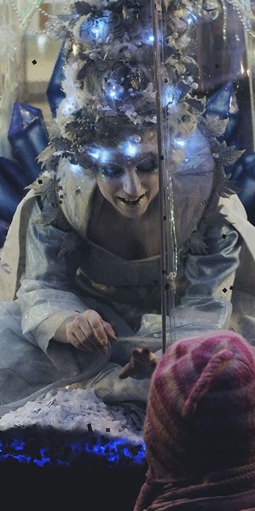 Living Snow Globe act illuminated Christmas entertainment