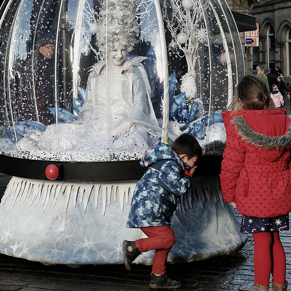 Living Snow Globe act performing at Bradford Christmas light switch-on