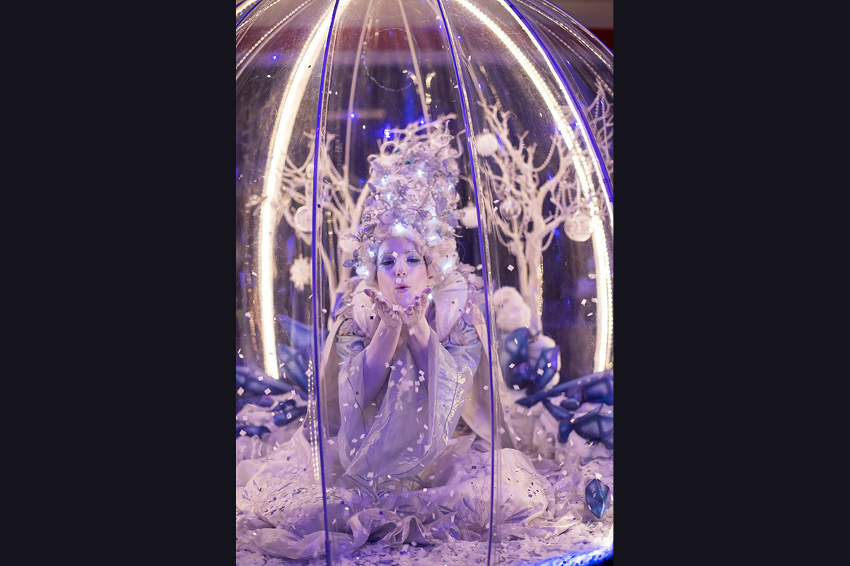 Living Snow Globe act entertaining at a Christmas event